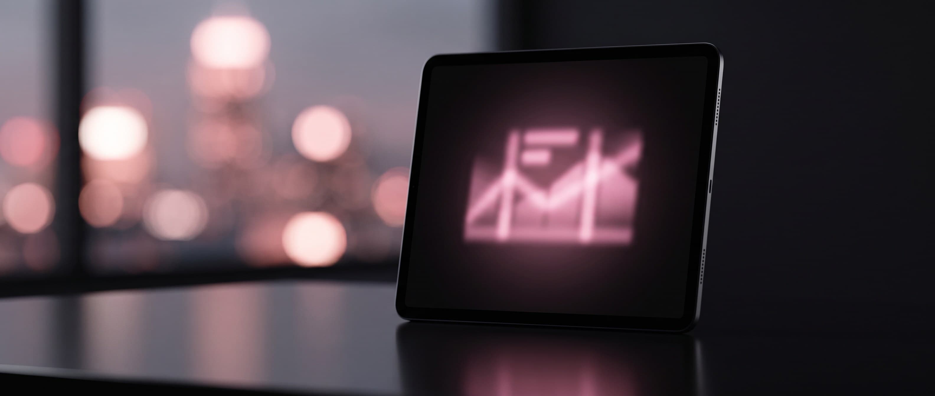 A tablet displaying a glowing brand dashboard on a reflective surface, with a blurred city skyline at dusk